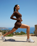 Seen women's workout set with long sleeve top and biker shorts, featuring a stylish athletic design and comfortable fit.