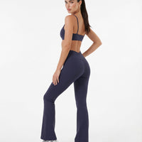 Seen women's flare yoga pants set with high-waist leggings and matching sports bra, shown in a comfortable activewear fit.