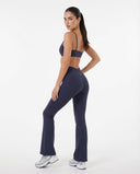 Seen women's flare yoga pants set with high-waist leggings and matching sports bra, shown in a comfortable activewear fit.