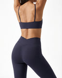 Seen flare yoga pants set with high waist leggings and matching sports bra, designed for women's activewear and comfortable movement.