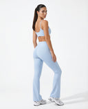 Seen women's flare yoga pants set with high waist leggings and sports bra, shown in a comfortable activewear outfit.