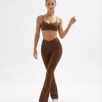 Seen flare yoga pants set with high waist leggings and sports bra, designed for women's activewear, shown in a stylish pose.