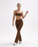 Seen flare yoga pants set with high waist leggings and sports bra, designed for women's activewear, shown in a stylish pose.