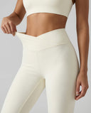 Seen flare yoga pants set with high waist leggings and matching sports bra, in a stylish activewear design.