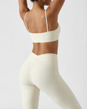 Seen flare yoga pants set featuring high-waist leggings and matching sports bra, designed for women's activewear and workout comfort.