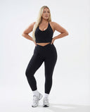 Seen high waist leggings set with sculpting fit and matching halter top, designed for women's activewear, shown on a model.