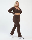 Seen flare yoga pants set with high waist and long sleeve crop top, featuring a stylish flare design and comfortable fit.