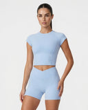 Light blue SculptFit women's activewear crop top and shorts set, shown with a fitted design and comfortable fabric.