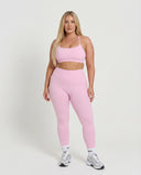 Seen women's seamless workout set with sculpting high waist leggings and matching top, designed for activewear and fitness.