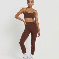 Seen women's seamless workout set with sculpting high waist leggings and matching sports top, ideal for activewear and exercise.