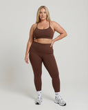 Seen women's seamless workout set with high waist leggings and matching top, designed for activewear and fitness activities.