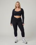 Seen women's activewear set featuring long sleeve top and high waist leggings in a coordinated athletic outfit.