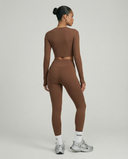 Seen women's activewear set featuring long sleeve top and high waist leggings, in breathable, stretchy fabric for workout comfort.