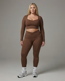 Seen women's activewear set featuring long sleeve top and high-waist leggings, ideal for workout and active lifestyle.