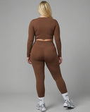 Women's activewear set with long sleeve top and high waist leggings by seen, featuring a comfortable, fitted athletic outfit.