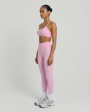 Seen women's seamless workout set with high waist leggings and matching top, designed for active and sculpting fitness wear.