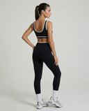 Woman wearing seamless sculpt activewear set with high waist leggings and supportive sports bra designed for gym, yoga, and athleisure wear.