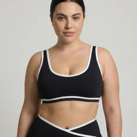 Woman wearing seamless sculpt activewear set with high waist leggings and supportive sports bra designed for gym, yoga, and athleisure wear.