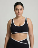 Woman wearing seamless sculpt activewear set with high waist leggings and supportive sports bra designed for gym, yoga, and athleisure wear.