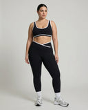 Woman wearing seamless sculpt activewear set with high waist leggings and supportive sports bra designed for gym, yoga, and athleisure wear.