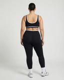 Woman wearing seamless sculpt activewear set with high waist leggings and supportive sports bra designed for gym, yoga, and athleisure wear.