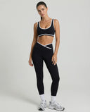 Woman wearing seamless sculpt activewear set with high waist leggings and supportive sports bra designed for gym, yoga, and athleisure wear.