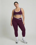 Woman wearing seamless sculpt activewear set with high waist leggings and supportive sports bra designed for gym, yoga, and athleisure wear.