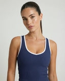 Woman wearing seamless sculpt high waist gym set with tank top and leggings in navy blue, shown from front and back.