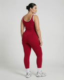 Woman wearing seamless sculpt high waist gym set with tank top and leggings in red, shown from front and back.
