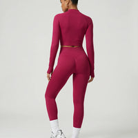 Woman wearing a seamless sculpting three piece activewear set with high waist leggings, sports bra, and fitted jacket paired with sneakers.
