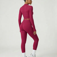 Woman wearing a seamless sculpting three piece activewear set with high waist leggings, sports bra, and fitted jacket paired with sneakers.