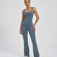 Front view of blue backless flare bodysuit on ghost mannequin showing square neckline and sculpting seam detail.