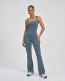 Front view of blue backless flare bodysuit on ghost mannequin showing square neckline and sculpting seam detail.