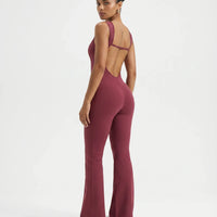 Back view of red backless bodysuit showing deep open-back design on a ghost mannequin.