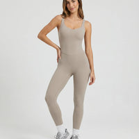 Front view of gray backless sculpting bodysuit on ghost mannequin showing sweetheart neckline and full-length silhouette.