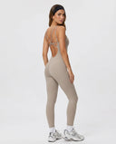 Back view of gray backless sculpting bodysuit on ghost mannequin highlighting open back cut and seamless construction.