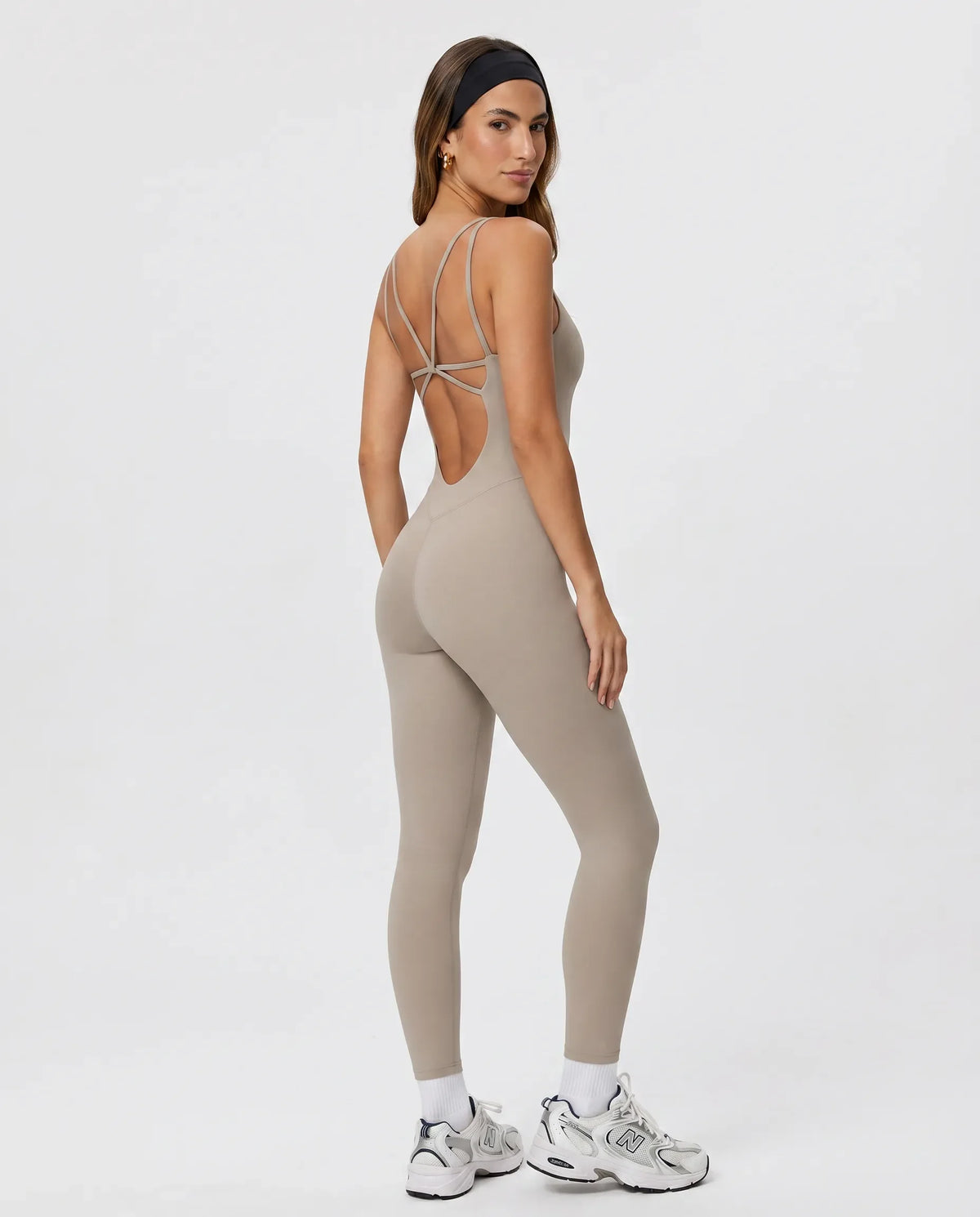 Back view of gray backless sculpting bodysuit on ghost mannequin highlighting open back cut and seamless construction.