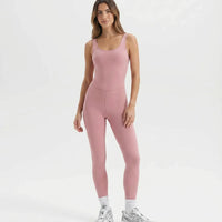 Ghost mannequin front view of pink backless full-length bodysuit showing scooped neckline and seamless waistline.