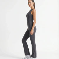 Plus size model wearing the ash backless flare bodysuit from the front, showing the sculpting fit across the torso and hips.