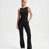 Front view of black backless flare bodysuit on ghost mannequin showing high neckline and flared legs.