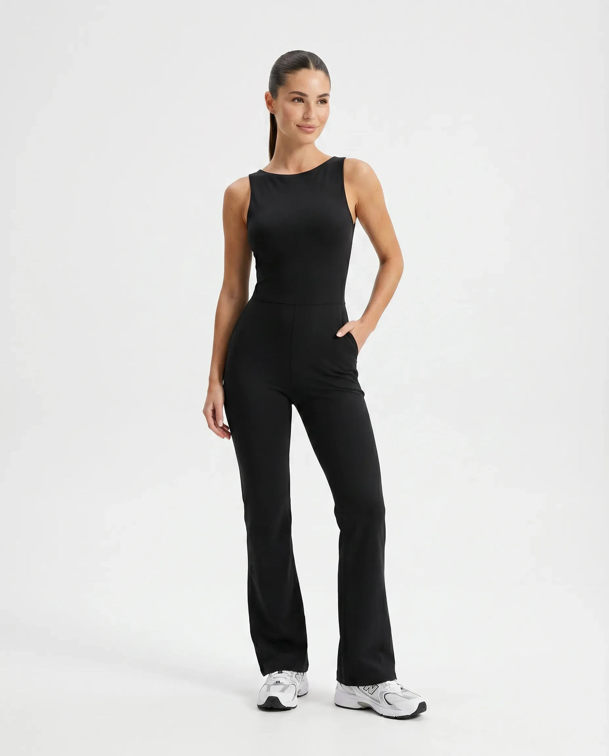 Front view of black backless flare bodysuit on ghost mannequin showing high neckline and flared legs.
