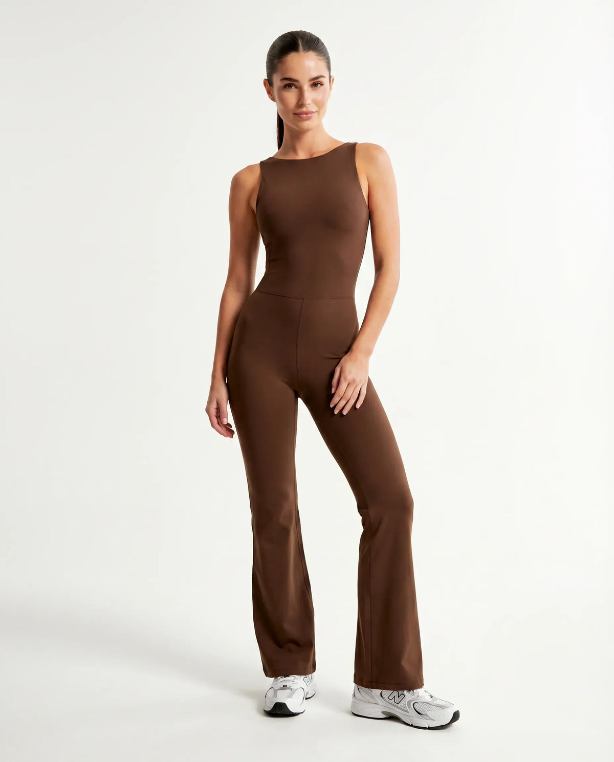 Front view of brown backless flare bodysuit on ghost mannequin showing high neckline and full-length flared legs.