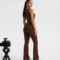Back view of brown backless flare bodysuit on ghost mannequin highlighting the open back cut and clean seam lines.