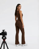 Back view of brown backless flare bodysuit on ghost mannequin highlighting the open back cut and clean seam lines.
