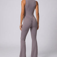 Ghost mannequin back view of purple backless bodysuit highlighting the open back cutout and flared legs.