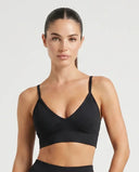 Ghost mannequin front view of a black sculpting V-neck bra top with thin straps and wide underband.