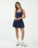 Front view of the SEEN Essential balloon hem dress in badge blue displayed on a ghost mannequin showing the square neckline and full skirt silhouette.