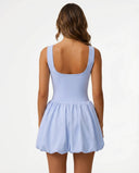 Ghost mannequin back view of light blue balloon hem dress displaying clean back panel and gathered skirt detail.