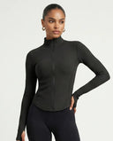 Front view of black sculpting zip-up activewear jacket on ghost mannequin showing ribbed panels and mock neckline.