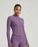 Ghost mannequin front view of purple ribbed zip-through jacket and high waist legging set showing corset seam detail.